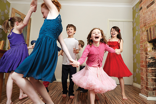 Children dancing at birthday party